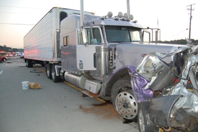 Photo of truck-tractor and Mazda Tribute at position of rest.