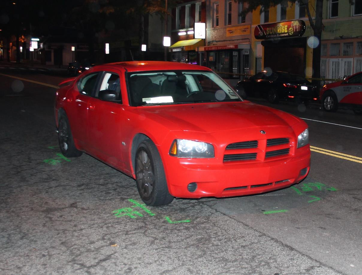 Crash car photographed at final rest position on Georgia Avenue NW.